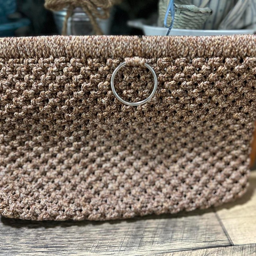 Vintage tan macrame clutch.